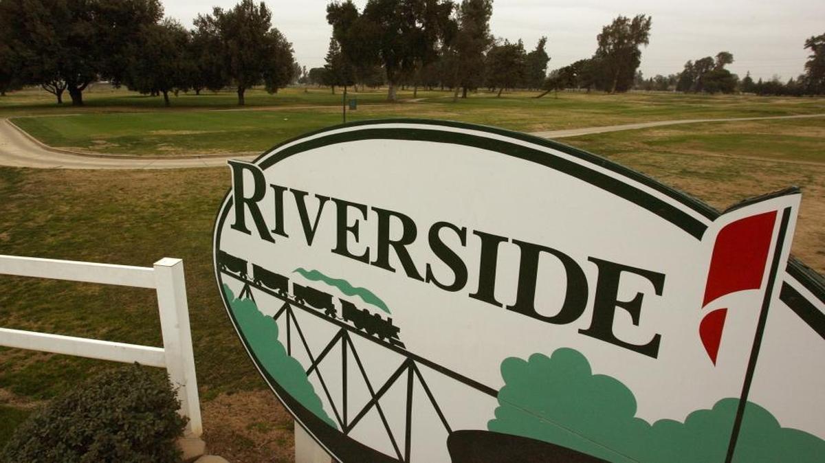 A sign at the entrance to Riverside Golf Course.