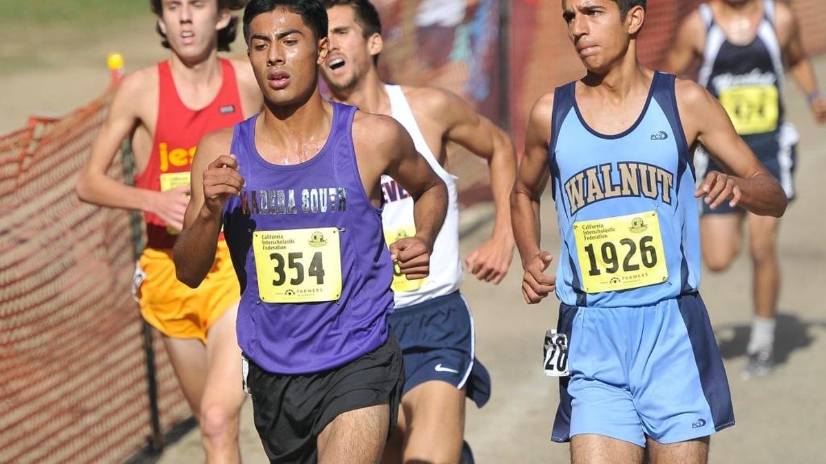 Madera South High’s Eduardo Herrera runs en route to a fourth-place finish at the 2014 CIF State Cross Country Championships at Woodward Park. The senior is third-ranked in the state entering this year’s meet, hoping to reel in No. 1 and defending champ Phillip Rocha of Arcadia.