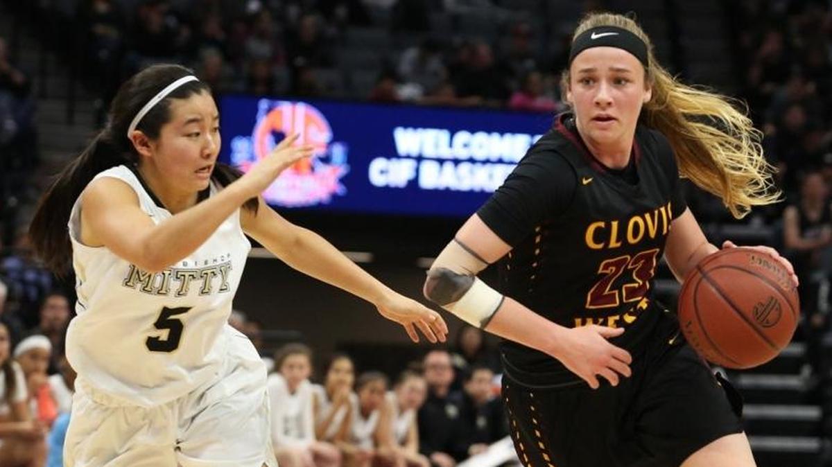Clovis West’s Madison Campbell drives past Krissy Miyahara of Archbishop Mitty in last season’s state championship game. Campbell scored 25 Monday to lead the Golden Eagles past St. Francis-Sacramento.