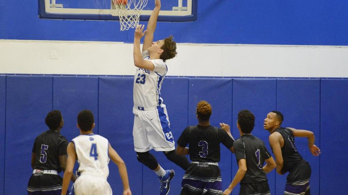 Madera High’s Ethan Richardson puts up a shot over the Fresno High defense during their nonconference game Dec. 23, 2015.