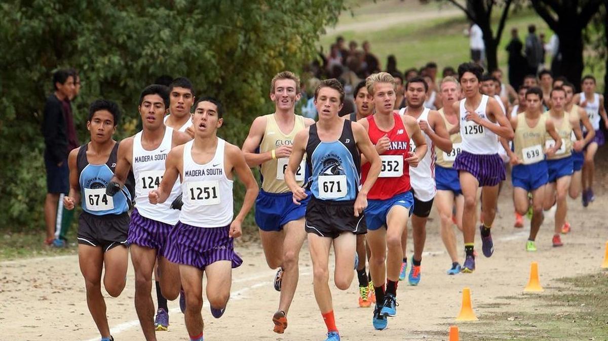 
Madera South High’s Miguel Villar (No. 1251) leads the pack during the 2014 Central Section Championships at Woodward Park.
