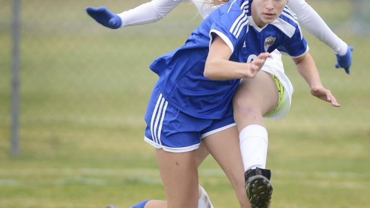 Clovis East High’s Madison Coleman, top, and Clovis’ Kelly Crouch collide while going for the ball in their Tri-River Athletic Conference match Friday. Coleman scored the only goal in the Timberwolves’ 1-0 win to open the TRAC season.