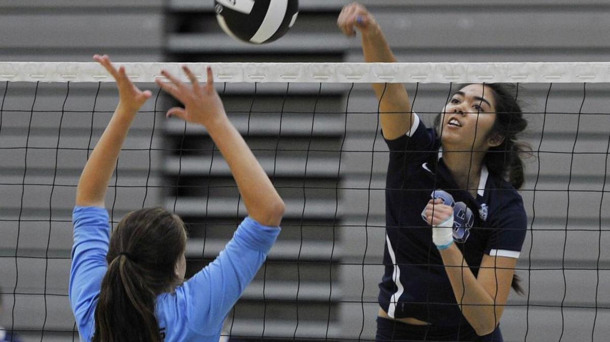 Clovis East’s Thaliana Grajeda, right, spikes the ball against Clovis North’s Madison Graville, left, during a match Oct. 3, 2015, at the John Riding Memorial Hard Driven. The Timberwolves, who won that tournament along with the program’s first TRAC title, is seeded No. 2 for the D-I playoffs that start next week.