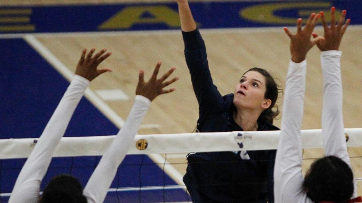 Central Valley Christian High’s Hailey Hilvers puts a spike past Independence’s Breana Runnels.