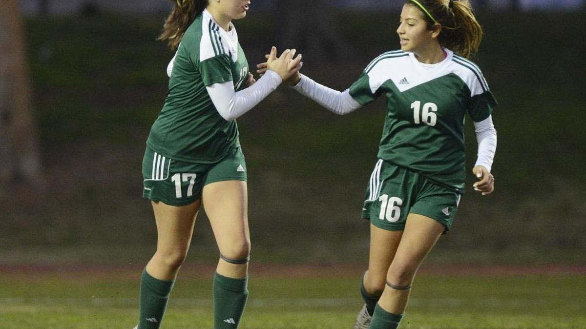 Hoover High’s Aidee Sanchez, left, is congratulated by Crystal Rios after Sanchez scored a goal in an eventual 6-0 victory over host McLane on Wednesday. Sanice Abina scored twice as the Patriots, ranked No. 13 in the Central Section by The Bee, improved to 13-2-4 and 5-0 in the North Yosemite League.