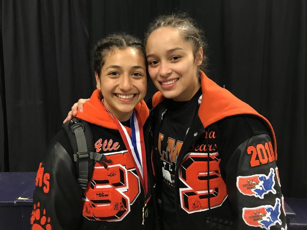 Selma High seniors Alleida Martinez (left) and Gracie Figueroa (right) became the first wrestlers to win four state championships while also finishing undefeated in their career. The two are signed to wrestling at Menlo College.