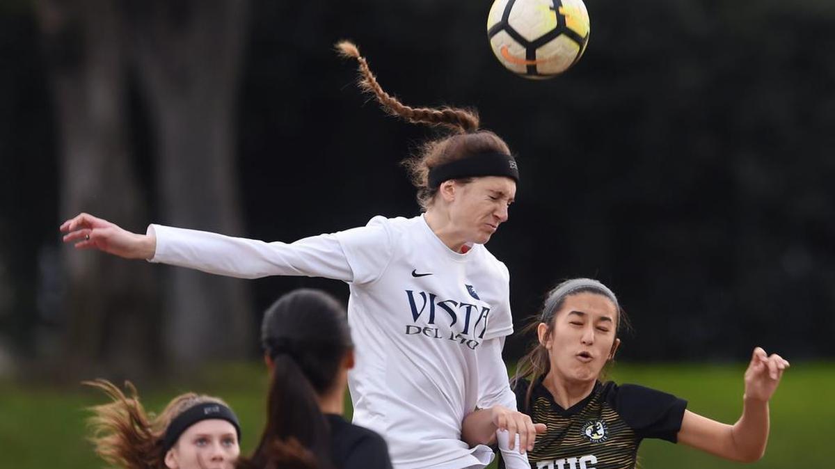 Payton Zanatta from Vista del Lago-Folsom rises above Edison’s Yani Trevino, bottom right, on a header during the Northern California Division III girls soccer quarterfinal Tuesday, Feb. 26, 2019 at McLane Stadium in Fresno.