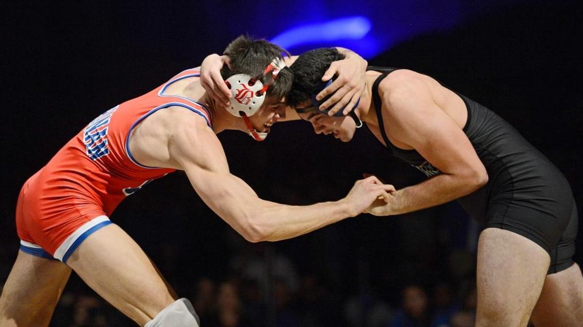 Buchanan’s Cade Belshay, left, and Clovis’ Ruger Wyneken will help their respective schools chase the team title at the CIF State Wrestling Championships this weekend at Bakersfield’s Rabobank Arena.