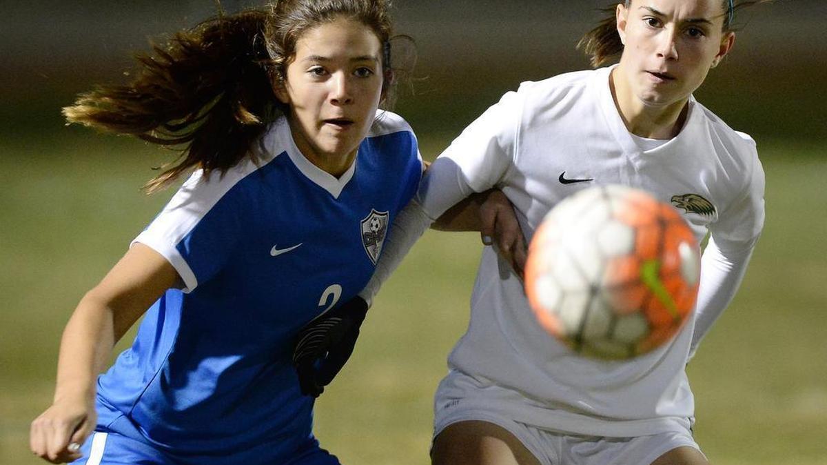 Liberty High’s Raina Wristen, right, and Clovis’ Julia Hardwick vie for the ball in their nonleague match Wednesday, Dec. 28, 2016, at Madera Ranchos. Clovis, ranked No. 3 in the Central Section by The Bee, improved to 8-0-2 with a 3-2 victory.