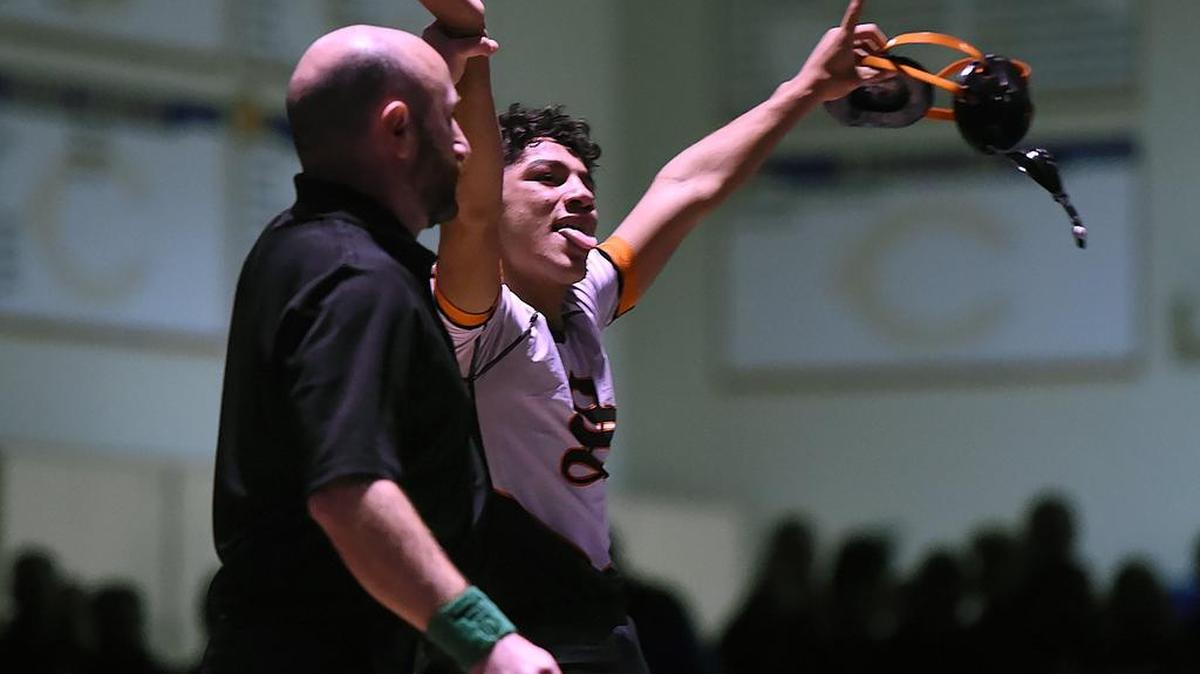 Selma High’s Richard Figueroa, celebrating his victory last month at the Doc Buchanan Invitational in Clovis, beat Buchanan’s Jack Gioffre 12-3 in the Central Section Masters 108-pound final Friday in Lemoore. Figueroa is ranked No. 1 in the state.
