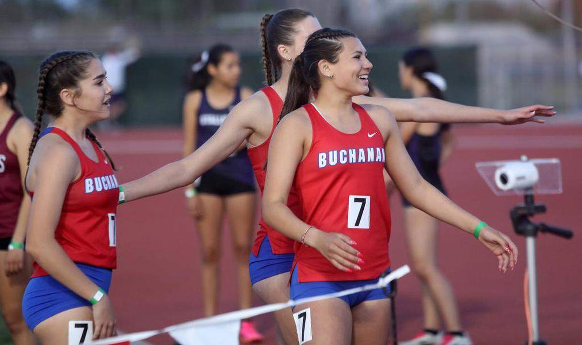 Buchanann High sophomore Elle Lomelí and teammates cheer a win in the girls 4x400 relay in 4:02.76 at the Sanger Metric Classic on April 21, 2023. Other team members were Tayler Torosian, Sierra Cornett, and Megan Clenney