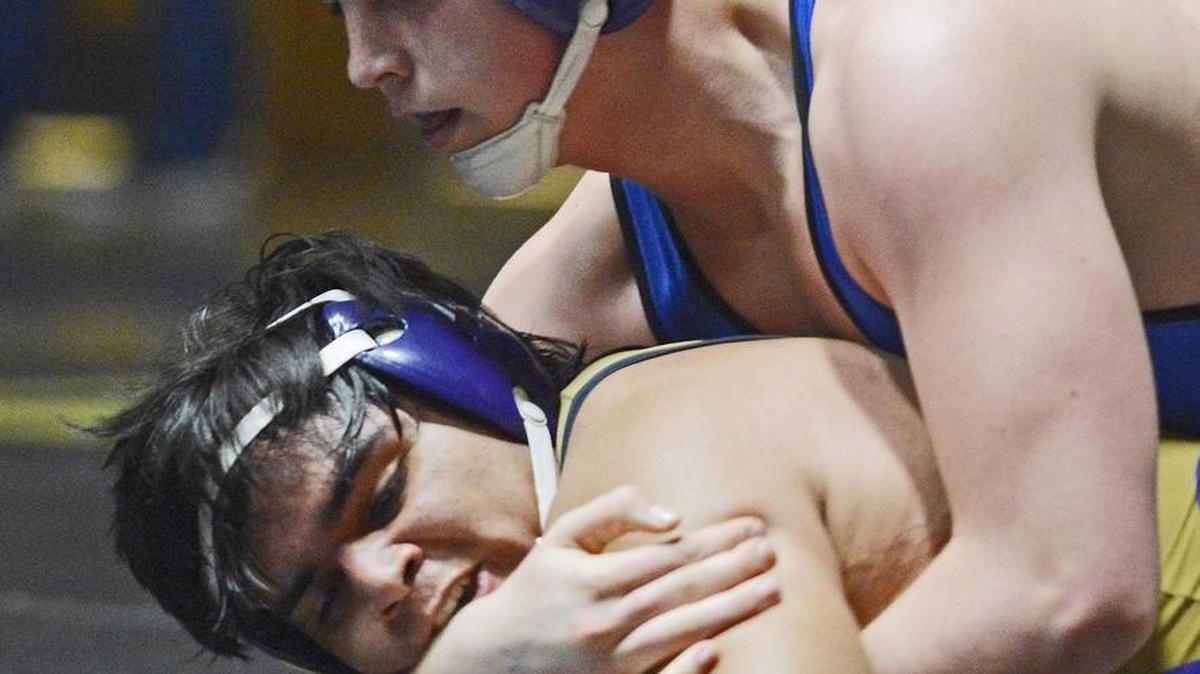 Defending CIF State 285-pound champion Seth Nevills, top, of Clovis is one of five state top-ranked wrestlers entered in the Clovis West Shootout on Saturday.