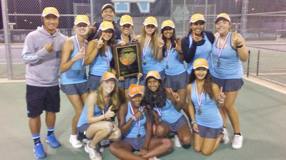 The Clovis North girls tennis team celebrates after sweeing Buchanan to win a second consecutive Central Section Division I girls eam tennis championship on Tuesday, Nov. 7, 2017, at Clovis North High.