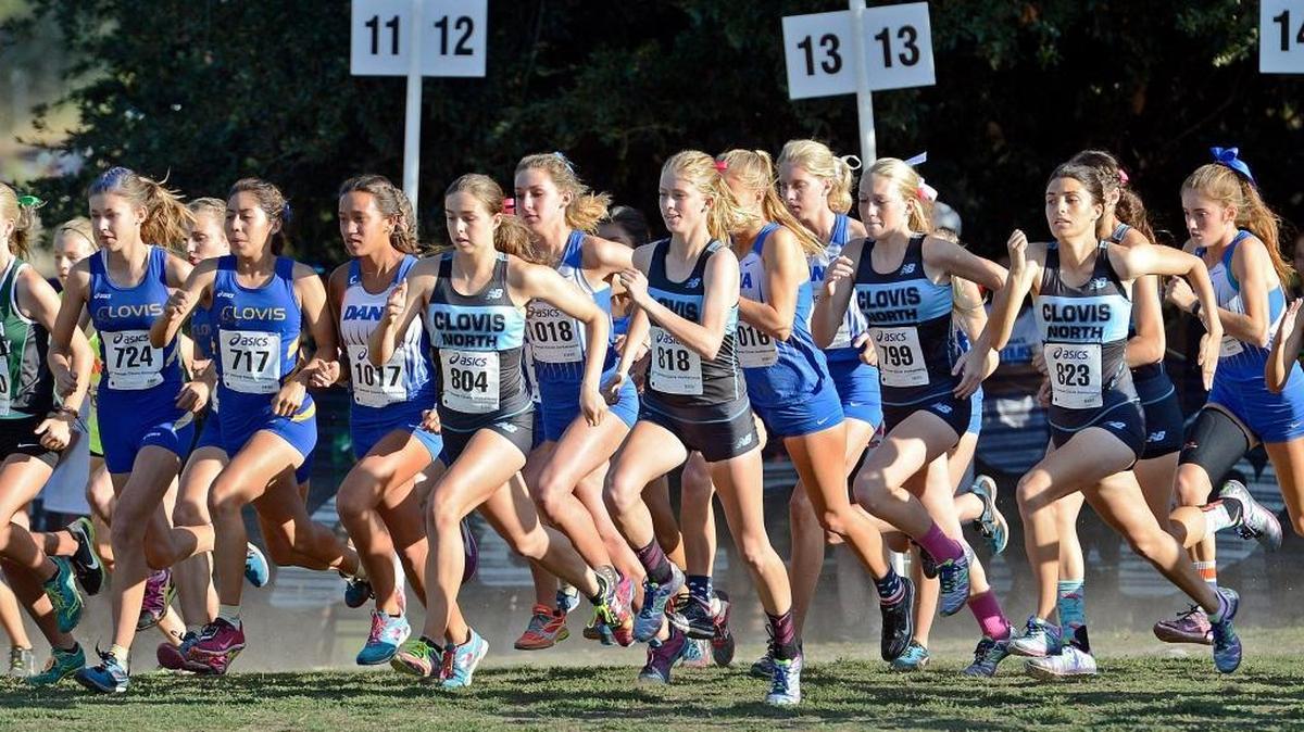 Clovis High and Clovis North cross country runners burst at the start of the girls championship race at the Asics Clovis Invitational on Oct. 10, 2015, at Woodward Park. Clovis North was the top Central Section team among the elite field, placing ninth. Buchanan and Clovis were 10th and 14th, respectively.