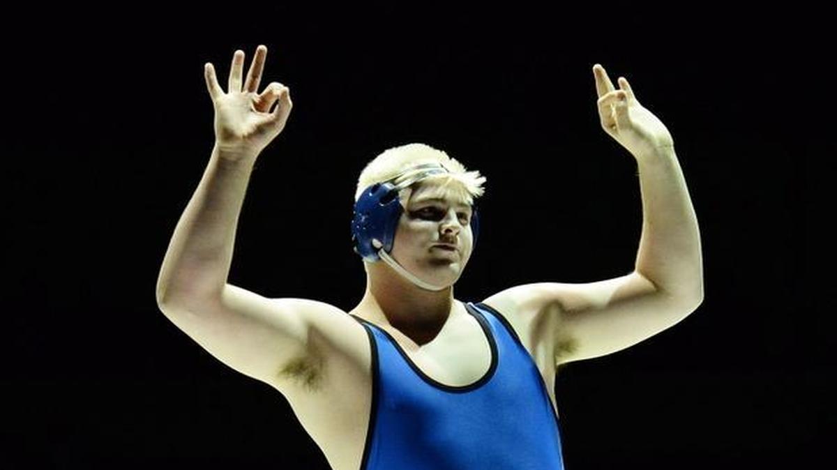 Clovis’ Seth Nevills, right, has committed to wrestle at NCAA Division I power Penn State, following in the footsteps of older brother Nick. Seth Nevills is a three-time CIF State champion.