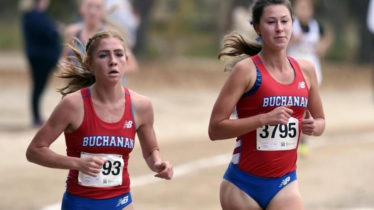 Buchanan’s Meagen Lowe, left, and Corie Smith, right, lead the pack in the Division I girls race at the 2017 CIF Central Section cross country championships held at Woodward Park. Lowe placed first, Smith came in second. Smith is No. 1 and Lowe No. 2 in the first 2018 Central Section rankings.
