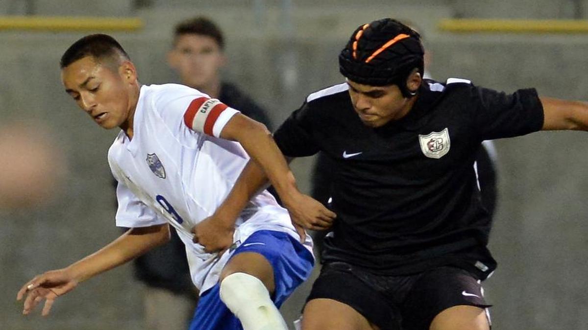 Ruben Kristopher Martinez, left, and Clovis High have risen to No. 2 in The Bee’s Central Section boys soccer rankings after a 3-0 start to Tri-River Athletic Conference play, including a 1-0 win over Michael Vega, right, and No. 4 Central on Jan. 15.