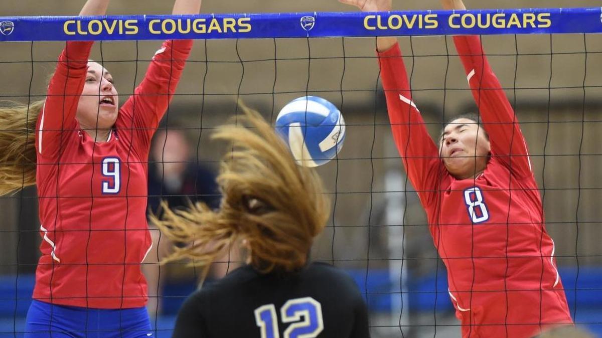 Clovis High’s Makena Ogas (12) spikes past Buchanan’s Lexi Pagani, left, and Amaya Weldon during the Thursday, Oct. 6, 2016, match at Clovis. Ogas and the Cougars – coming off a five-set loss to Central – won 25-23, 25-22, 25-22 to improve to 30-6 overall and 3-1 in the Tri-River Athletic Conference. The Bears are 18-5 and 2-2.