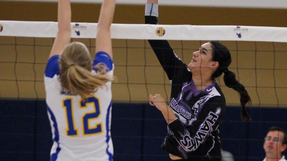 Samantha Arellano of Mission Oak puts a shot past a Bakersfield Christian defender in the Central Section Division III championship match Saturday at West Hills-Lemoore. Bakersfield Christian outlasted the Hawks 20-25, 25-17, 25-14, 27-25.