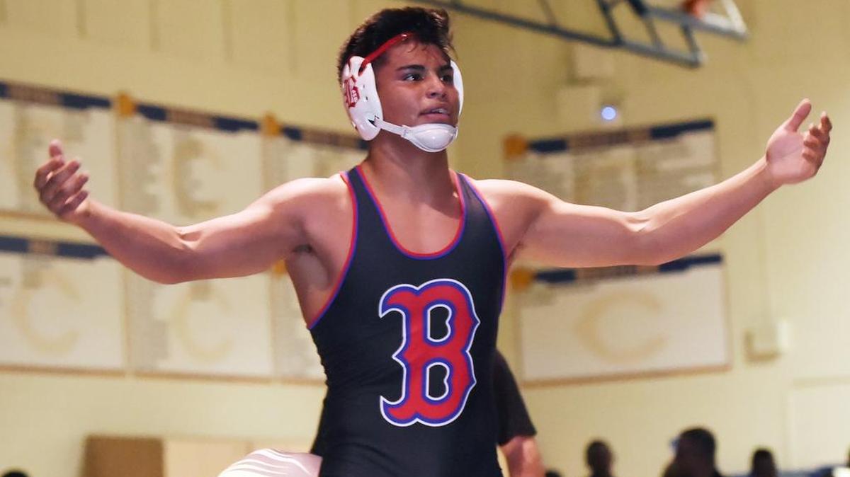 Buchanan’s Matthew Olguin raises his arms to the crowd as he wins the 2019 Doc Buchanan Invitational wrestling championship in January. Olguin is one of eight Bears who have advanced to the semifinals at the state meet in Bakersfield, putting the Bears on track for a fourth straight team title.