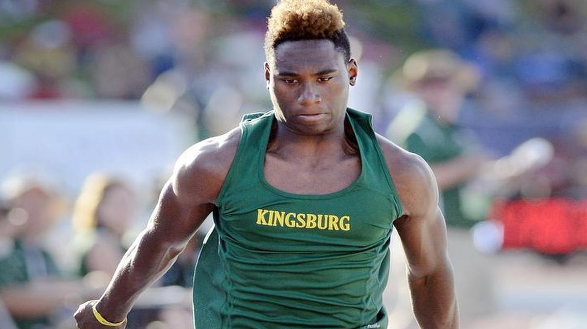 Kingsburg’s Seth Brooks competes in the long jump during Friday’s qualifying.