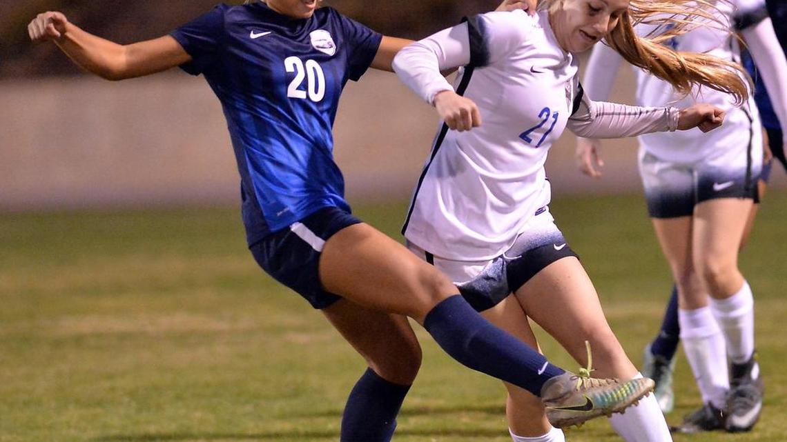 Bullard’s Alyssa Renovato, left, tries to take the ball from Clovis’ Kassie Christensen during their match at Clovis High on Tuesday, Dec. 13, 2016, in Clovis. Clovis won 3-1.