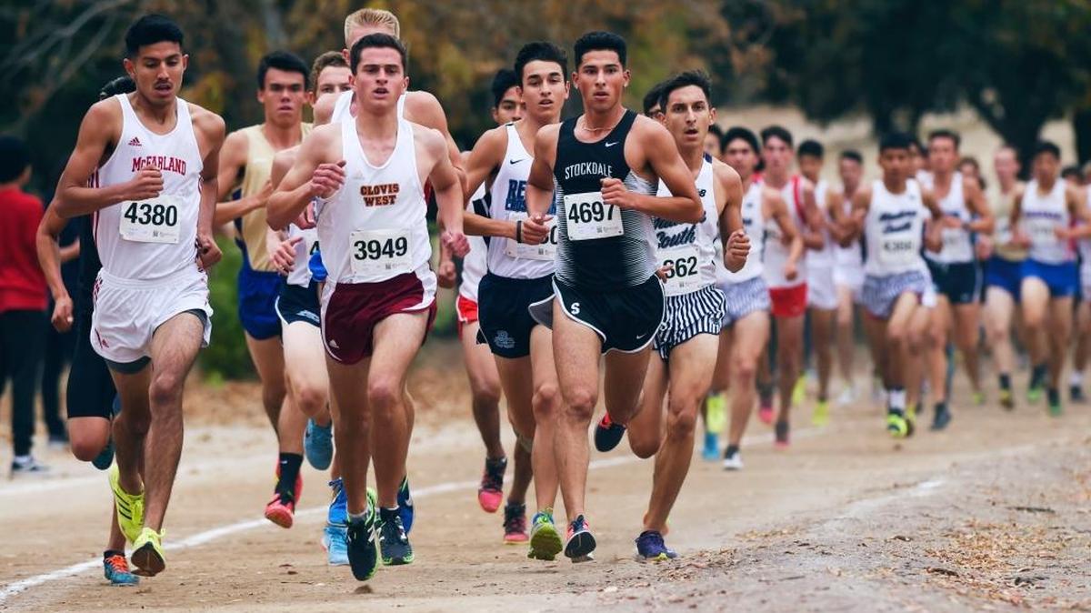 McFarland High’s Jose Rodriguez, left, Clovis West’s Pierson Lamborn, center, and Stockdale’s Marcus Mota, lead the Division I boys race at the Central Section Cross Country Championships on Thursday, Nov. 16, 2017, at Woodward Park Mota won the race in 15:30.5.
