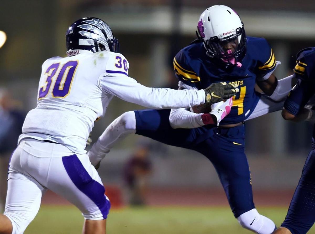 Sunnyside High’s Bre’Aun Heights, right, is the 2017 All-North Yosemite League football MVP.
