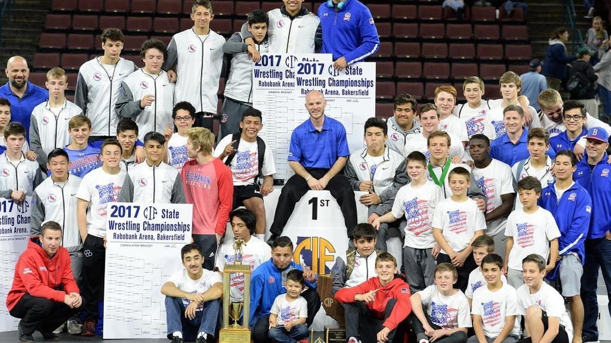 The Buchanan wrestling team celebrates winning its second straight CIF State Wrestling Championships team title at Rabobank Arena in Bakersfield on Saturday, March 4, 2017.