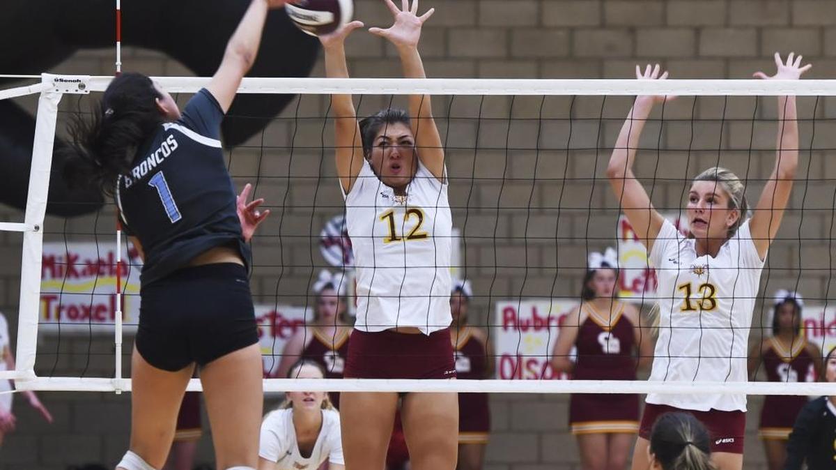Clovis West’s Mikaela Troxell, center, blocks Clovis North’s Marina Gonzalezs’ spike with Madelyn Letterman to the right in a Tri-River Athletic Conference volleyball match Tuesday evening, Oct. 24, 2017 in Fresno. Clovis West won the fifth set 16-14. Both teams advanced to the Central Section Division I quarterfinals with opening-round victories Thursday.