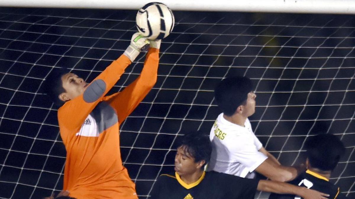 Edison High goalkeeper Anthony Avila blocks a shot by Roosevelt on Wednesday, Nov. 29, 2017. Andres Garcia and Andreas Solis scored goals for Edison in a 2-1 nonleague win.