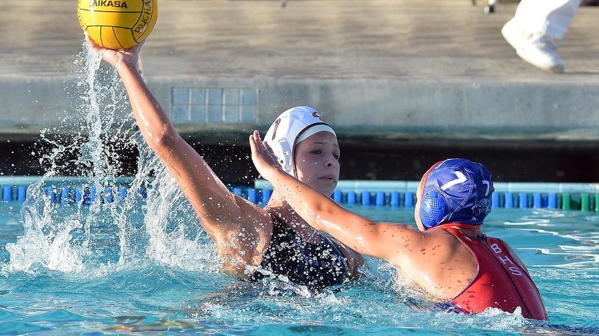 
Clovis West’s Ally Clague, left, looks for an opening against Buchanan’s Abbey Ervin during their girls water polo match at Buchanan High in Clovis, California on Sept. 16, 2015.
