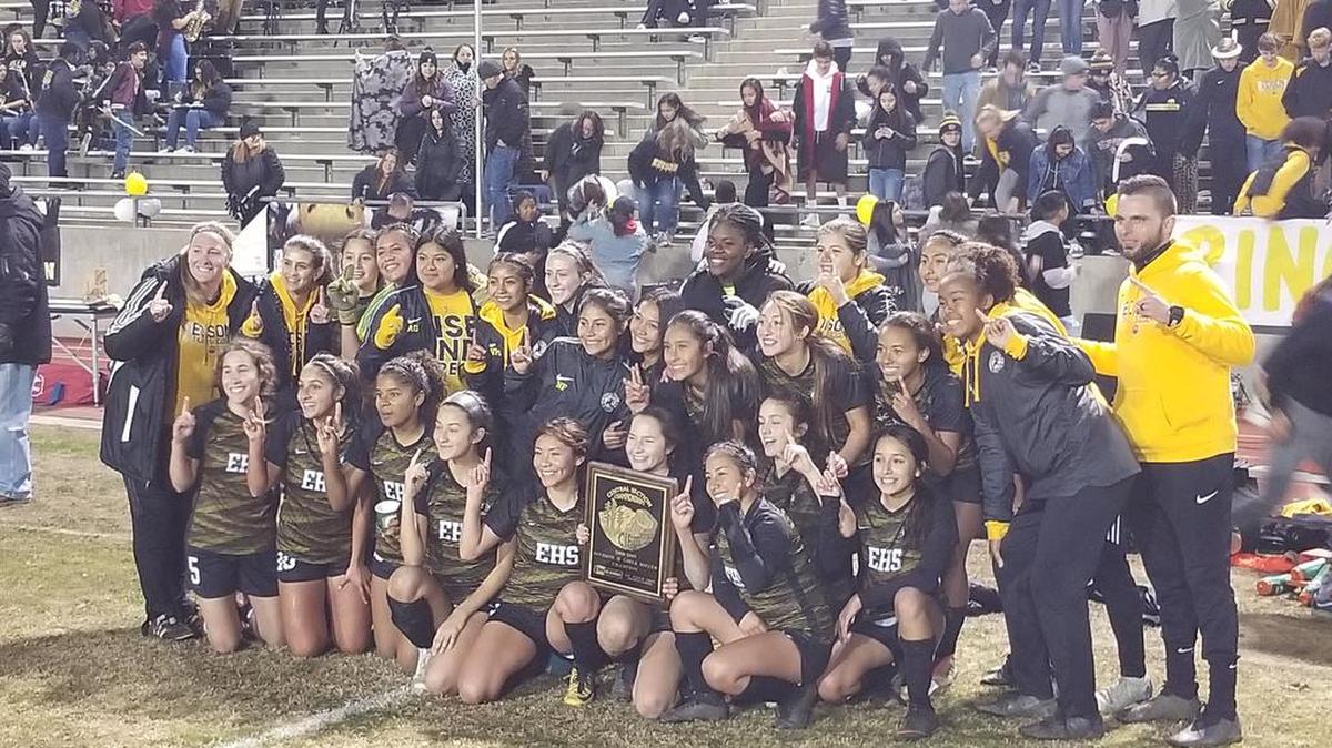 The Edison High girls soccer team celebrates its Central Section Division II championship after a 2-1 win over Liberty-Madera Ranchos on Friday night at McLane Stadium.