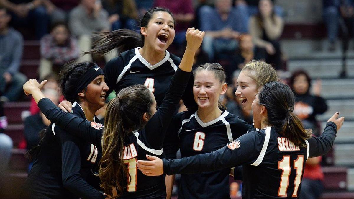 Selma players celebrate their victory over Fresno Christian in their Division V girls volleyball match at Fresno Christian on Tuesday, Nov. 7, 2017. Selma beat the Eagles 3-0 to advance to the semifinals.