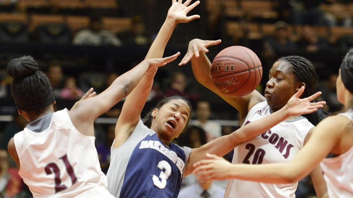 Bakersfield High’s Shalay Williams has the ball stripped away by Independence’s Ebony Sanders in the teams’ Central Section Division II championship game Friday at Selland Arena. Sanders and her teammates limited the Drillers to 6-of-54 shooting in a 40-23 victory that secured the Falcons a second straight title.
