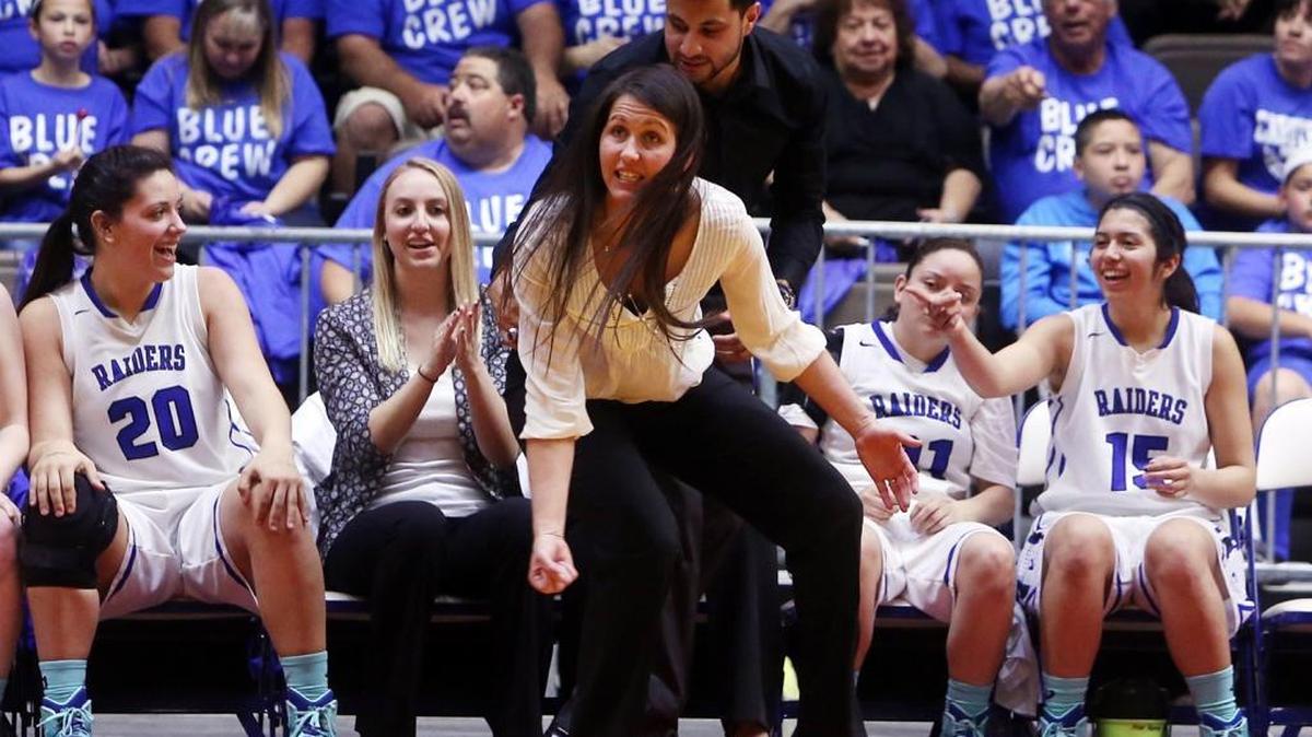 Caruthers High coach Anna Almeida gets into the action during the 2015 Central Section Division IV girls basketball title game against Bakersfield Christian. The Blue Raiders, who won 60-34, are back at Selland looking to complete another championship run after a 23-7 season but must get by Memorial of the County/Metro Athletic Conference.