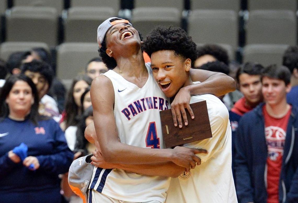 Memorial's Jalen Green, left, celebrates with teammate Lunden Taylor after defeating Selma in their boys Division II CIF Central Section championship basketball game at Selland Arena in Fresno on Friday, March 2, 2018.