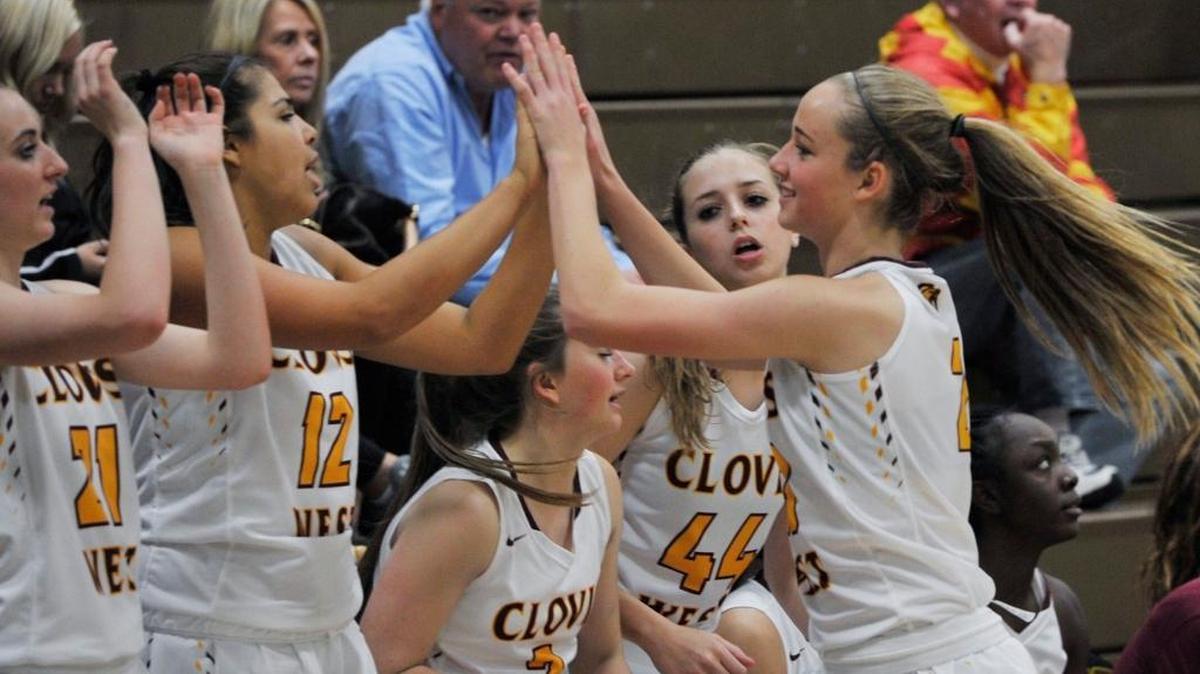 Clovis West’s Maddie Campbell, right, celebrates with the bench during the Golden Eagles’ 101-9 win over Chavez on Dec. 3, 2015. Saturday, Dec. 26, Clovis West topped that margin with a 114-9 win in Southern California.