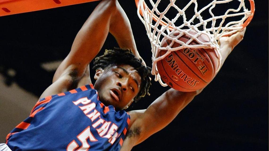 Former Memorial High guard Deon Stroud dunks the ball against Ridgeview during their Division II boys basketball championship game at Selland Arena on Friday, March 3, 3017. Stroud, who spent his freshman season at Texas-El Paso, is transferring back home to Fresno State.