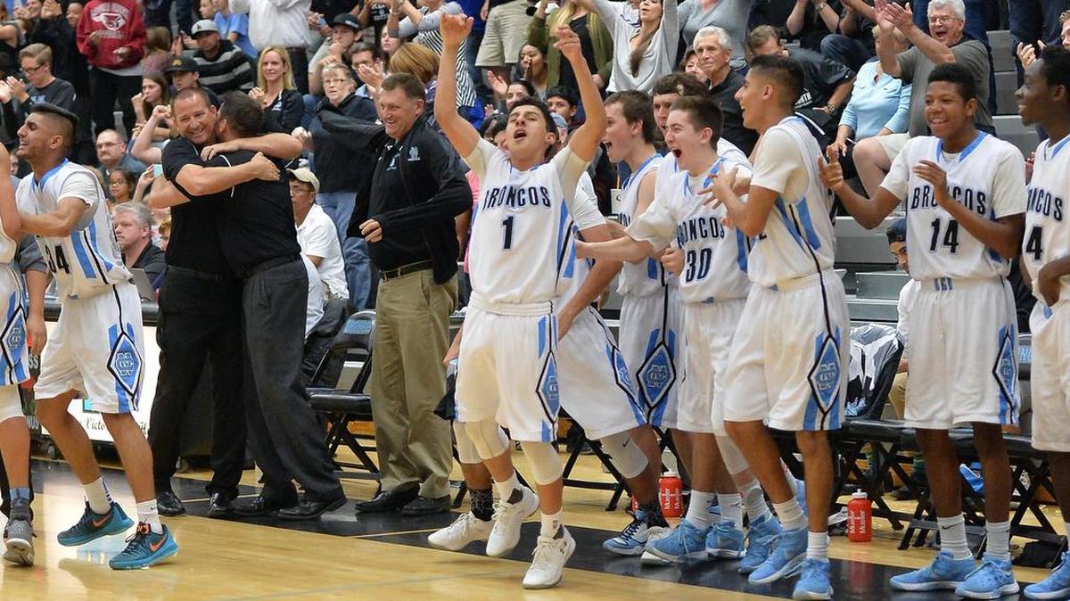 Clovis North celebrates its 69-63 win over Centennial in the Central Section basketball semifinals on Tuesday, March 1, 2016 at Clovis North High School in Fresno.