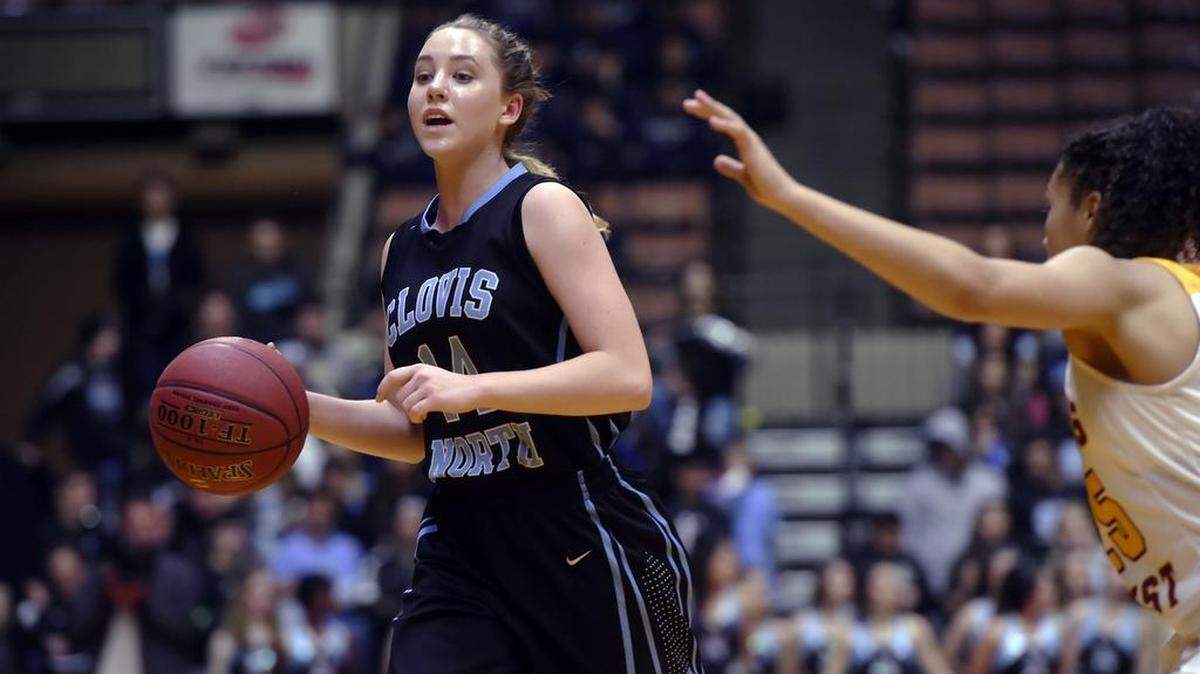 Clovis North's Rowan Hein moves the ball against Clovis West during the Central Section Division I basketball championship Saturday evening, March 3, 2018 in Fresno.