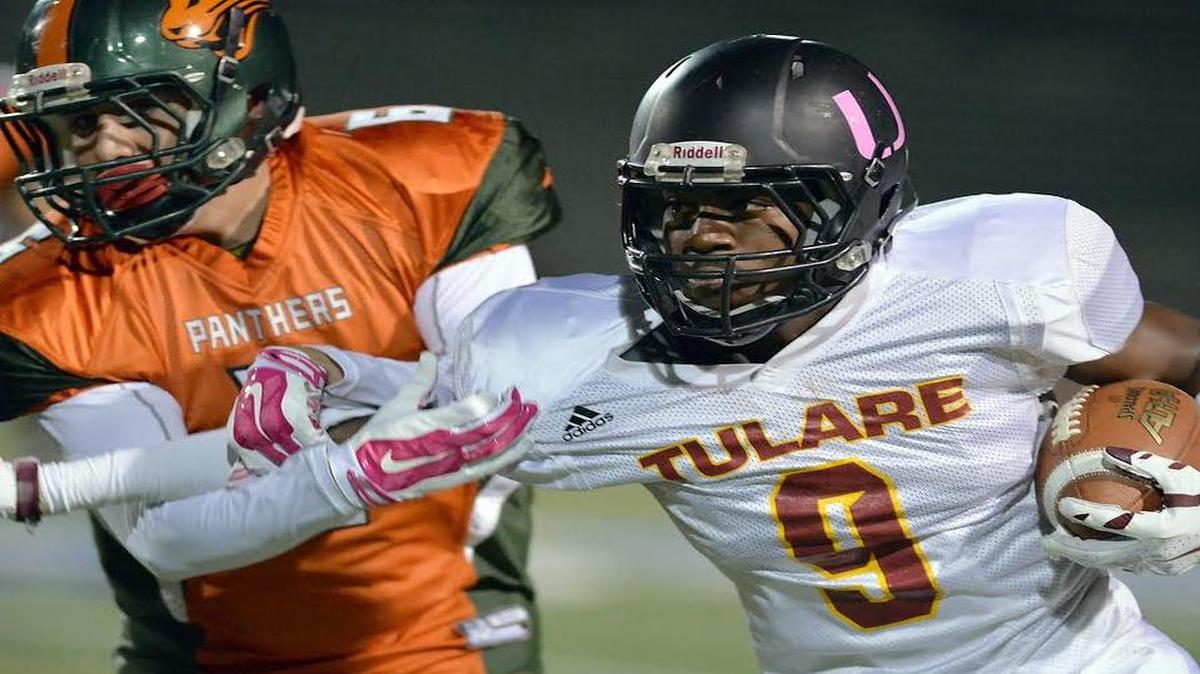 FILE: Tulare’s Emoryie Edwards, right, carries the ball in a 2015 game. In Thursday’s 69-10 victory over Monache, the Fresno State commit had 11 receptions for 265 yards and three touchdowns.