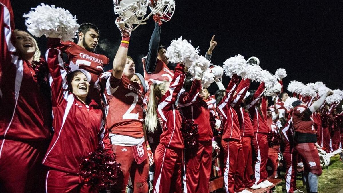 Chowchilla players and cheerleaders celebrate a 28-16 win over the Fairfax Lions in the Southern California Regional IV-A Bowl Championship game at Chowchilla High School in Chowchilla Calif., Saturday, Dec. 12, 2015.