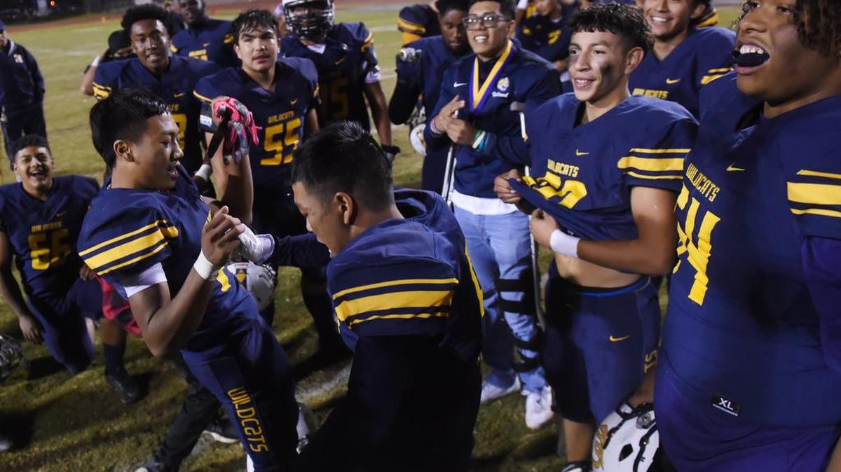 Sunnyside High players celebrate their home win over Reedley in the North Yosemite League football championship in 2019.