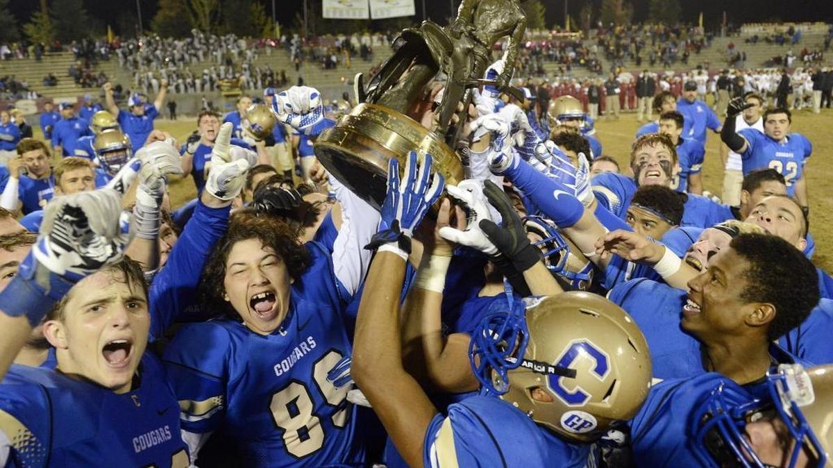 Clovis players celebrated not only winning the Range Rider Trophy with a 20-12 win over Clovis West Friday at Lamonica Stadium, but also the top seed in the Central Section Division I playoffs, as announced Saturday.