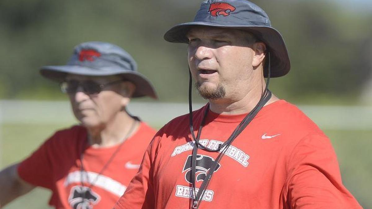 Kyle Biggs moves from Fowler to Central to take over the Grizzlies’ football program. His father, Bill Biggs in the background, is going with him.