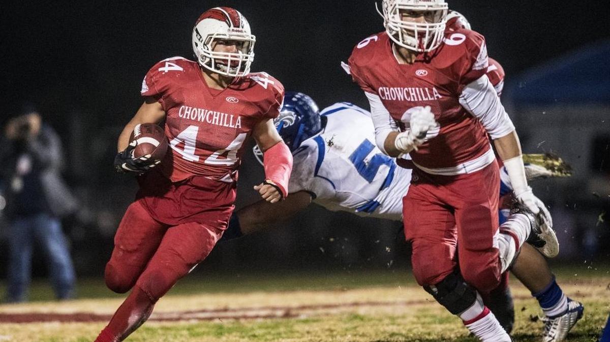 Chowchilla senior running back Alex Gutierrez looks for an opening during Saturday’s Division IV-A State Bowl Championship game against Sierra-Manteca. Gutierrez’s fourth-quarter touchdown run gave Chowchilla a late lead, but the Timberwolves rallied back for a 20-15 victory.