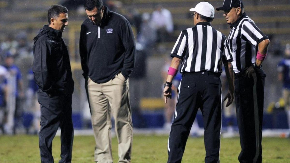 
A meeting is held on the field with 6 minutes left in the game to decide to delay play because of lightning as Central led Clovis 21-12 Thursday night.
