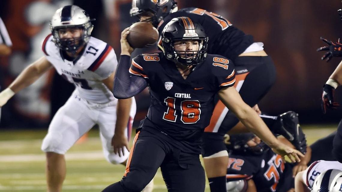 FILE: Central High’s quarterback Trent Tompkins scrambles for a pass against Liberty High Sept. 8, 2017 in Fresno. Tompkins threw three touchdown passes in a 49-30 loss to nationally ranked De La Salle High School in Concord on Saturday, Sept. 23, 2017.