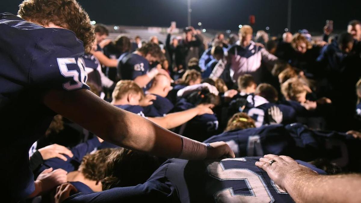 Central Valley Christian prays as a team after defeating Morse 30-14 at the CIF Southern California Division 4-AA football tournament Friday night, Nov. 30, 2018 in Visalia.